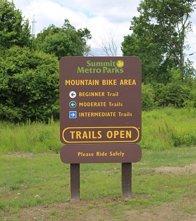 A Summit Metro Parks sign for the Mountain Bike Area of Hampton Hills Metro Park.