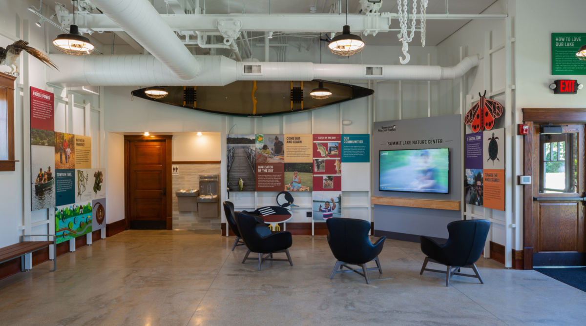 Colorful interpretive displays cover the walls of a nature center.