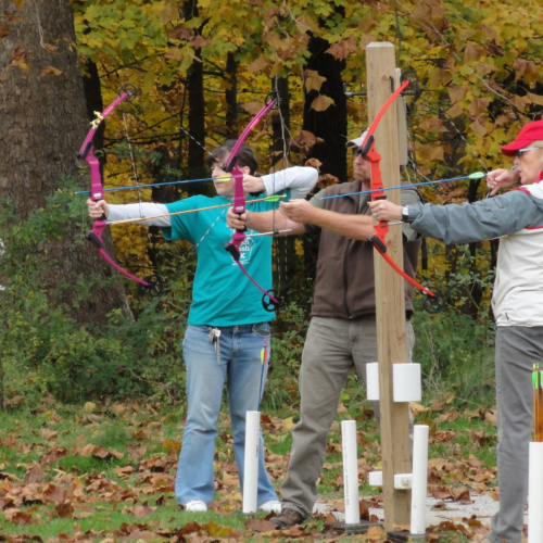 Group of seniors practicing archery