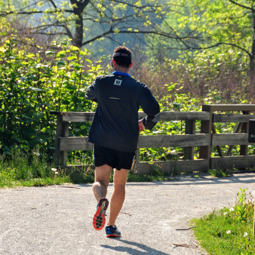 A runner travels along the Towpath Trail near Merriman Valley.