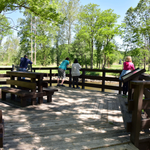 Visitors enjoy views of the Cuyahoga River from an observation deck between the Memorial Parkway and Big Bend trailheads.