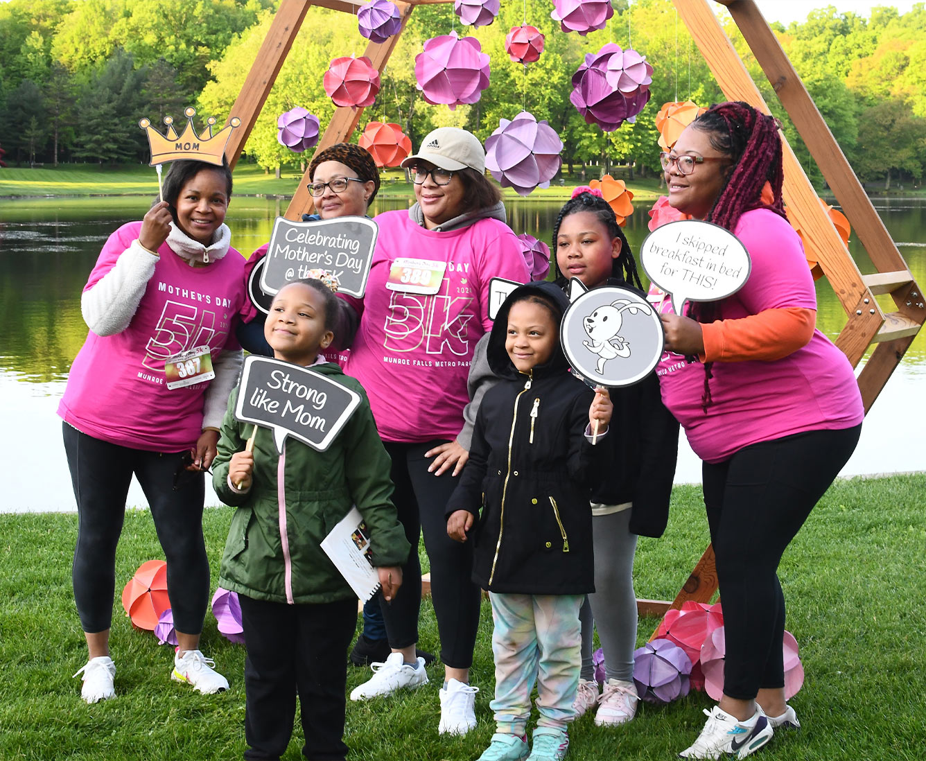 A family poses for a group photo at the 2024 Mother's Day 5K.